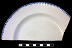 Blue edged impressed and unscalloped refined white earthenware plate. Rim diameter: 8.50”, from 18BC27, Feature 30.